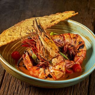 Grilled Jumbo Tiger Prawns with creamy prawn bisque and squid ink spaghetti at Flare Italian Restaurant, Karon Beach, Phuket